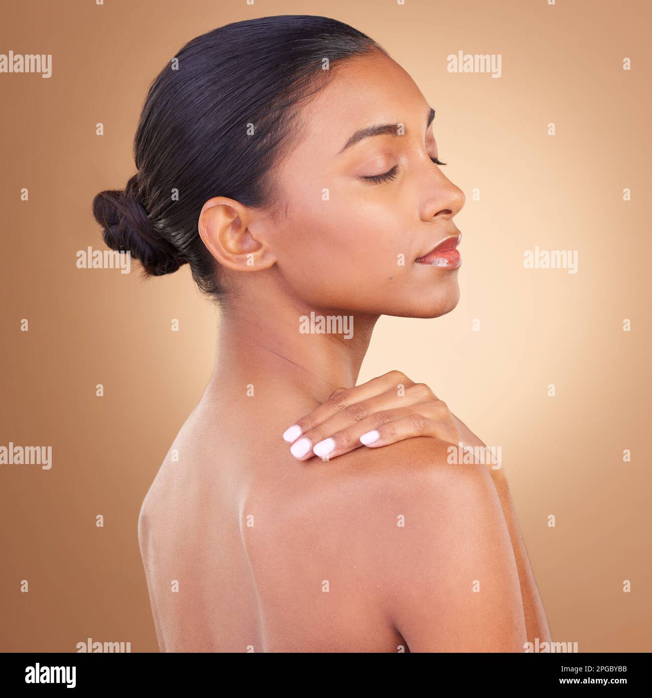 Beauty, wellness and back of Indian woman in studio with eyes closed