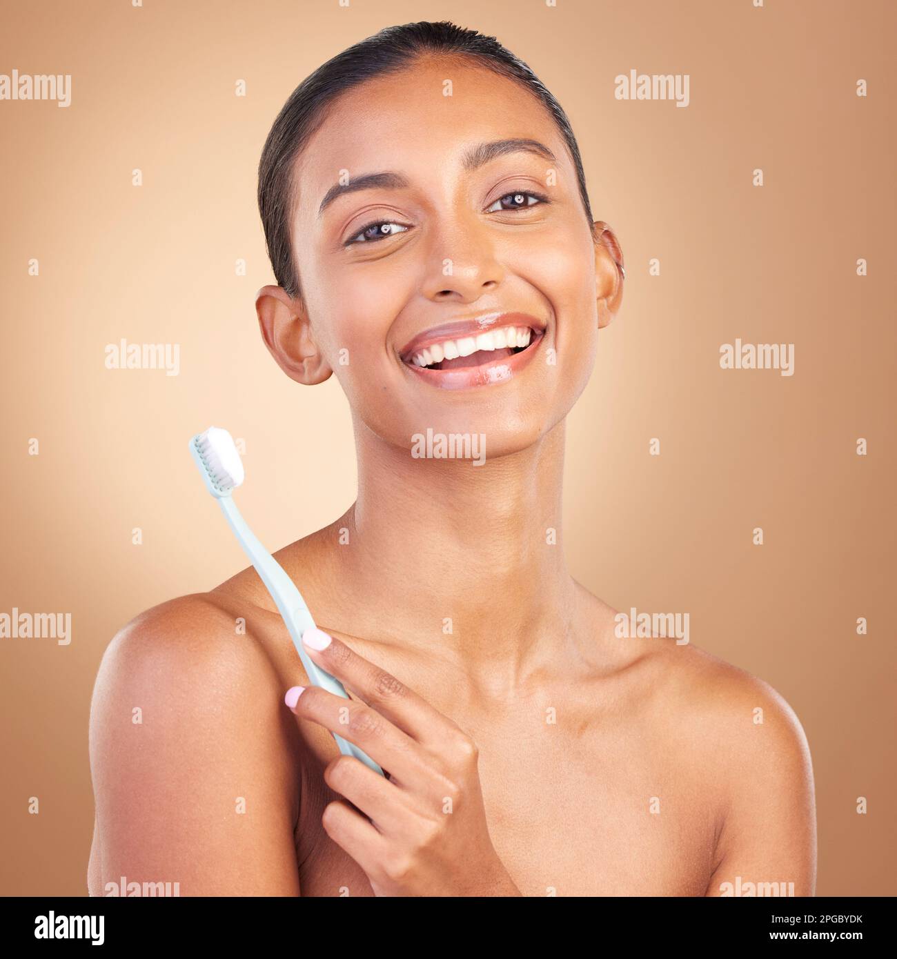 Beauty, smile and toothbrush with portrait of indian woman in studio ...