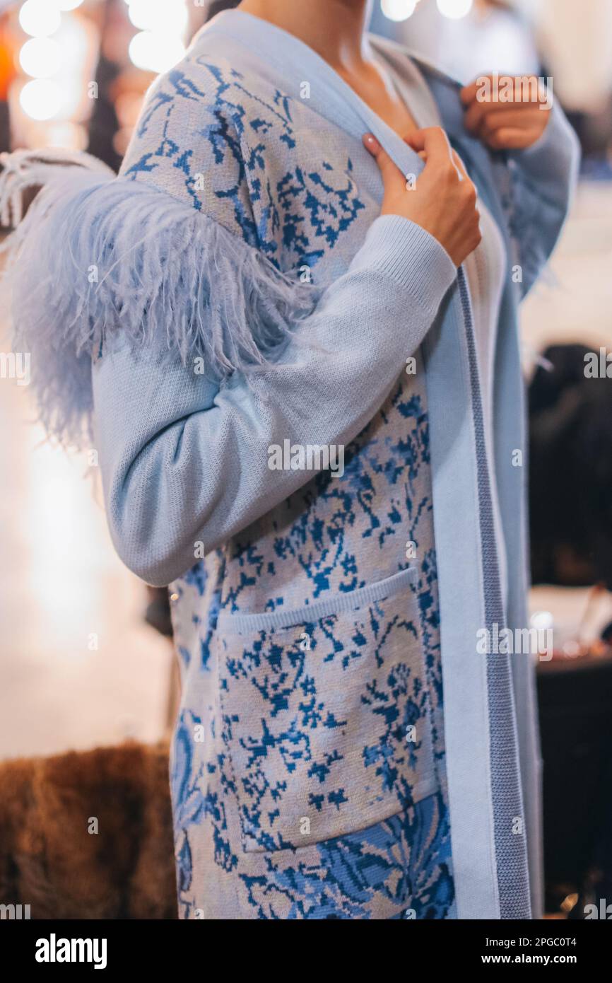 Female figure in knitting blue elegant autumn cardigan. Fashion collection details Stock Photo