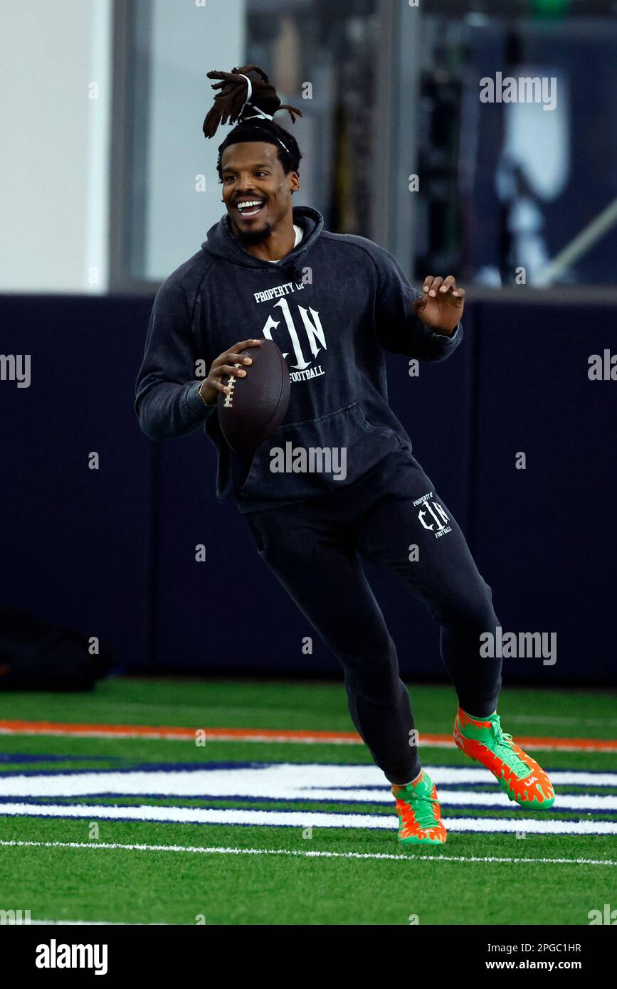 Former NFL and Auburn quarterback, Cam Newton, throws a pass during