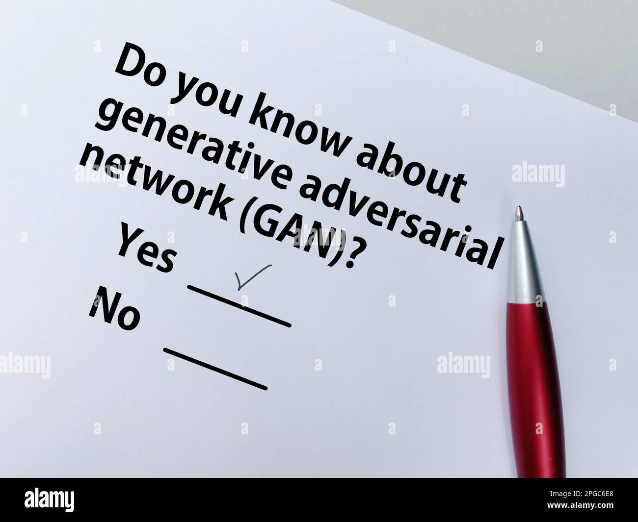 A person is answering question about artificial intelligence. He knows about generative adversarial network (GAN) Stock Photo