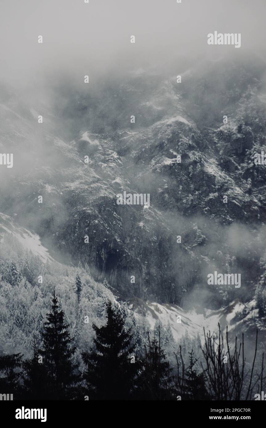 Backdrops Over Ranges A scenic landscape with a backdrop of mountain ranges and a cloudy sky ...