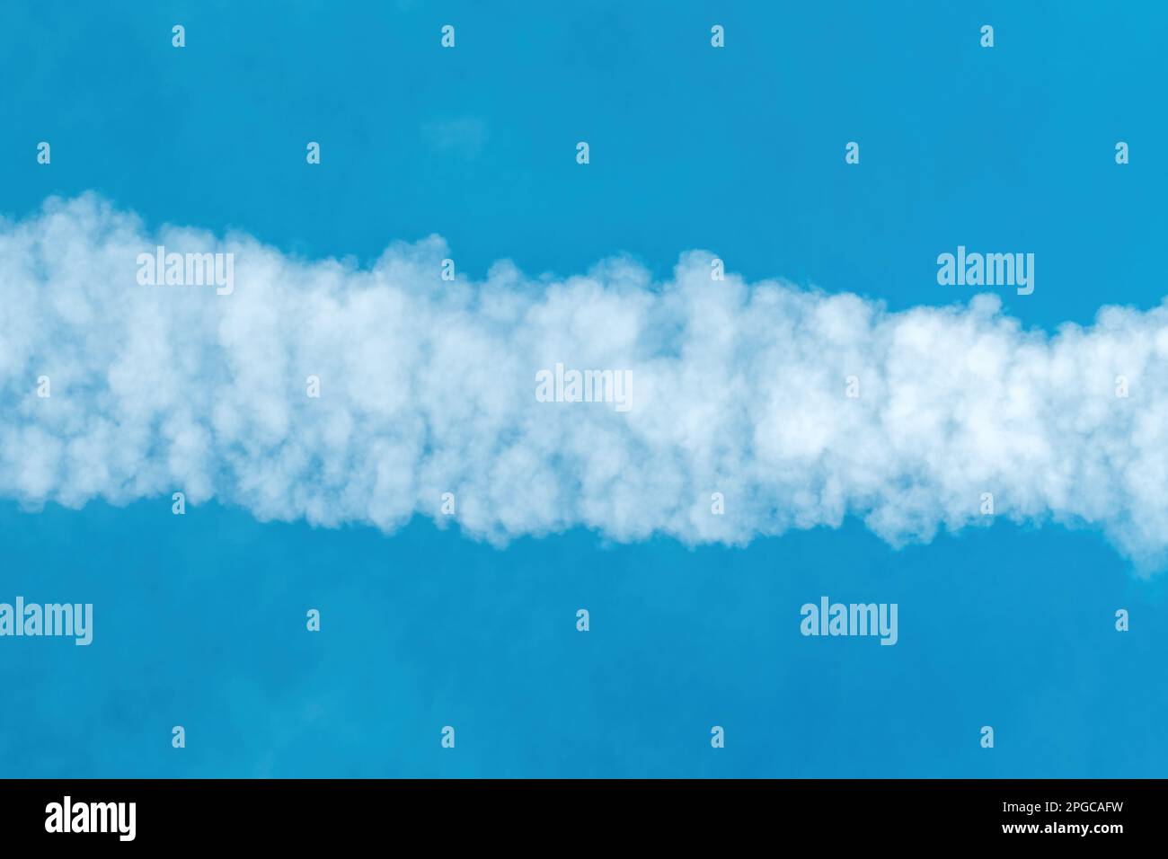 Airplane contrail pattern across the blue sky, directly below Stock Photo