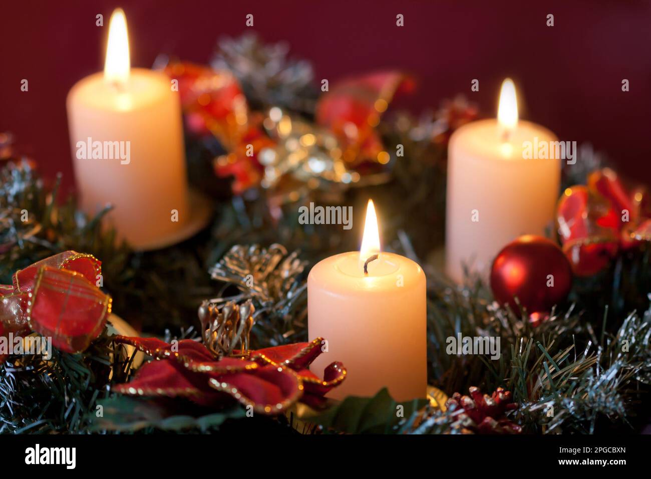 Advent wreath with burning candles for the pre Christmas time Stock