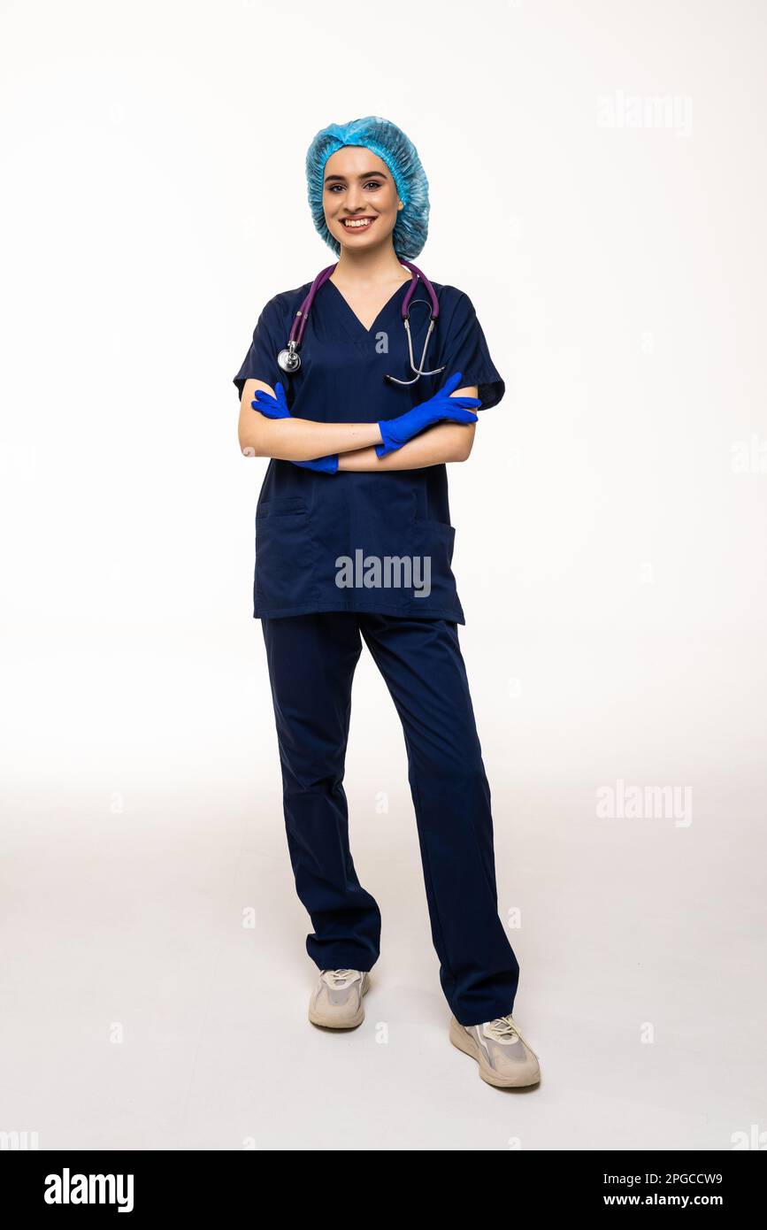 Friendly female doctor smiling - isolated over white background Stock Photo