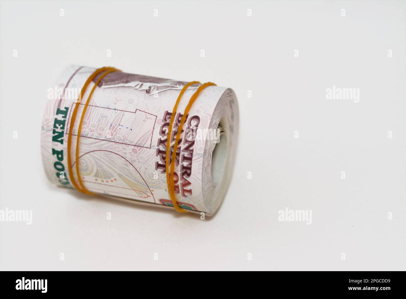 10 EGP LE ten Egyptian pounds cash money bills rolled up with rubber ...