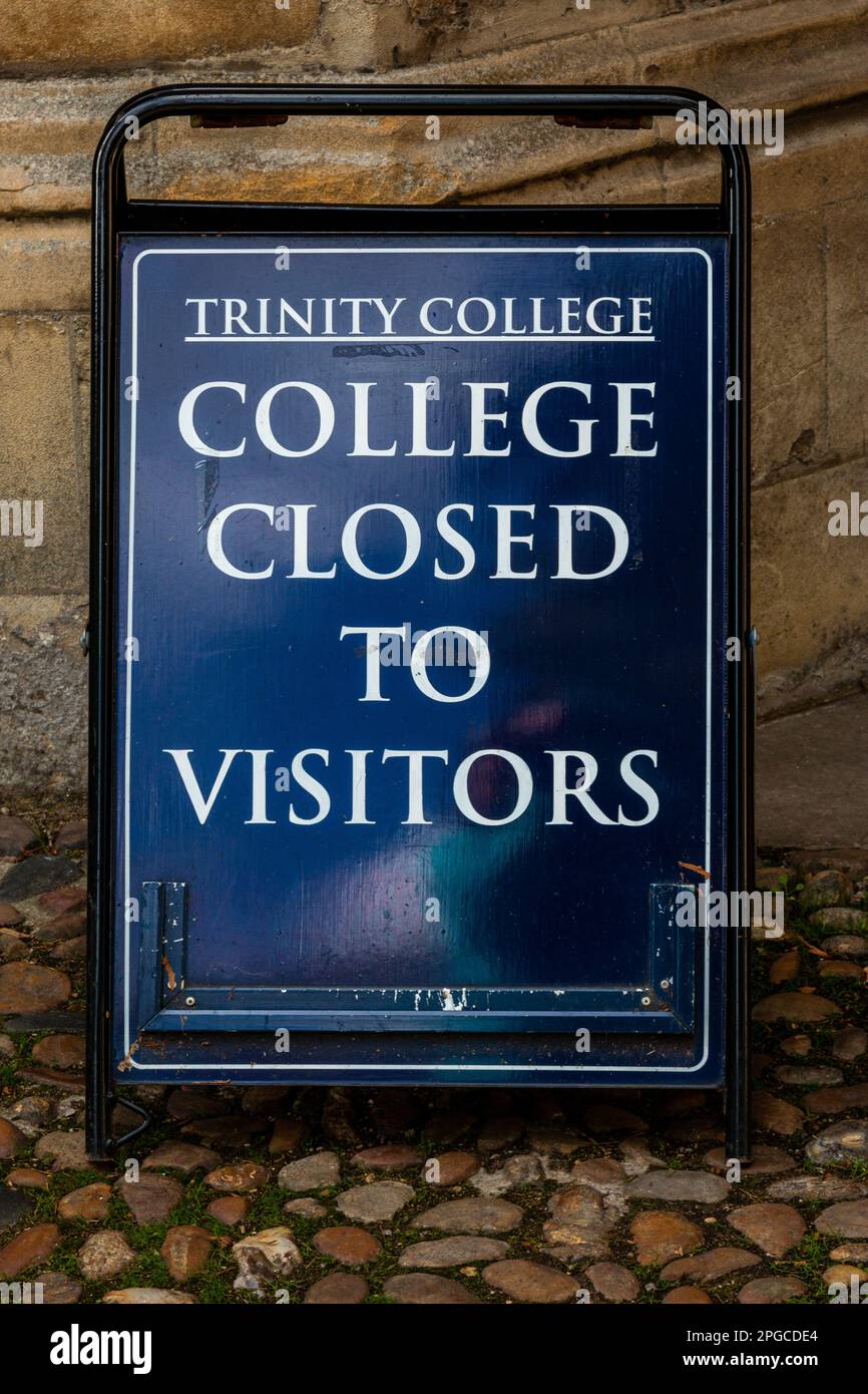 The closed to visitors sign outside Trinity College, Cambridge University, UK Stock Photo