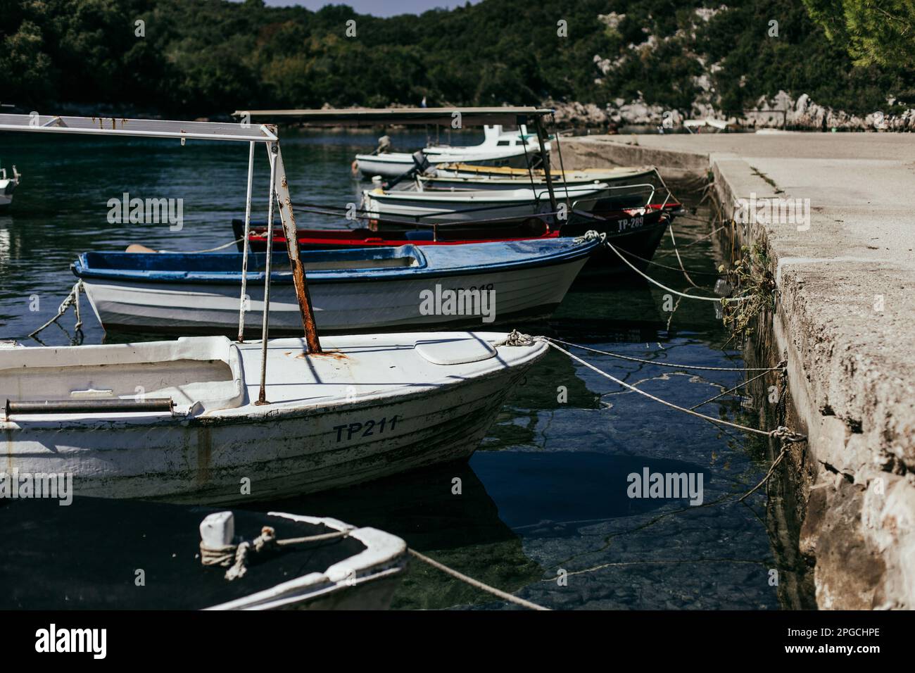 Fisherman holding an old fishing net, small traditional Croatian fishing  from Dalmatia, Croatia Stock Photo - Alamy