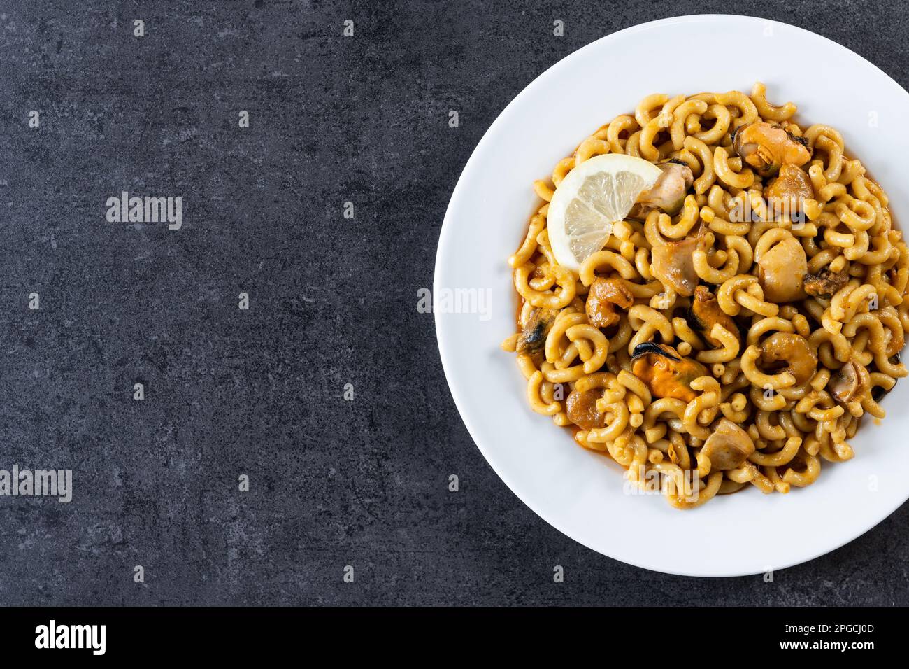 a spanish fideua, a typical noodles casserole with seafood Stock Photo -  Alamy