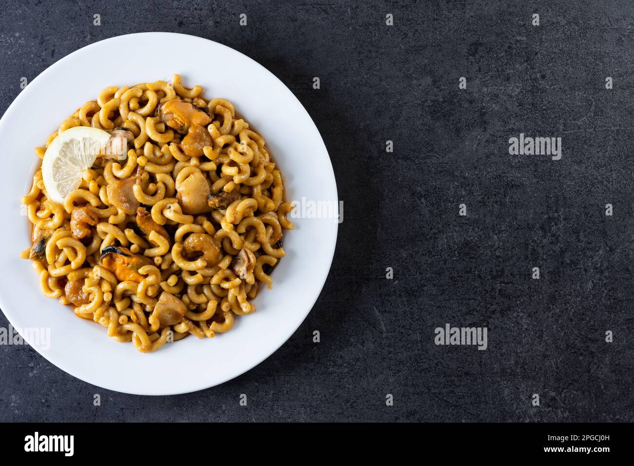 a spanish fideua, a typical noodles casserole with seafood Stock Photo -  Alamy