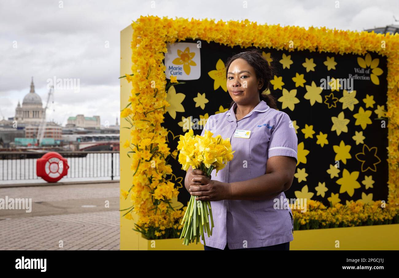 EDITORIAL USE ONLY Marie Curie nurse Beth Namara at the end-of-life care charity's Marie Curie's Wall of Reflection on London's South Bank ahead of the third annual National Day of Reflection on Thursday. Issue date: Wednesday March 22, 2023. Stock Photo