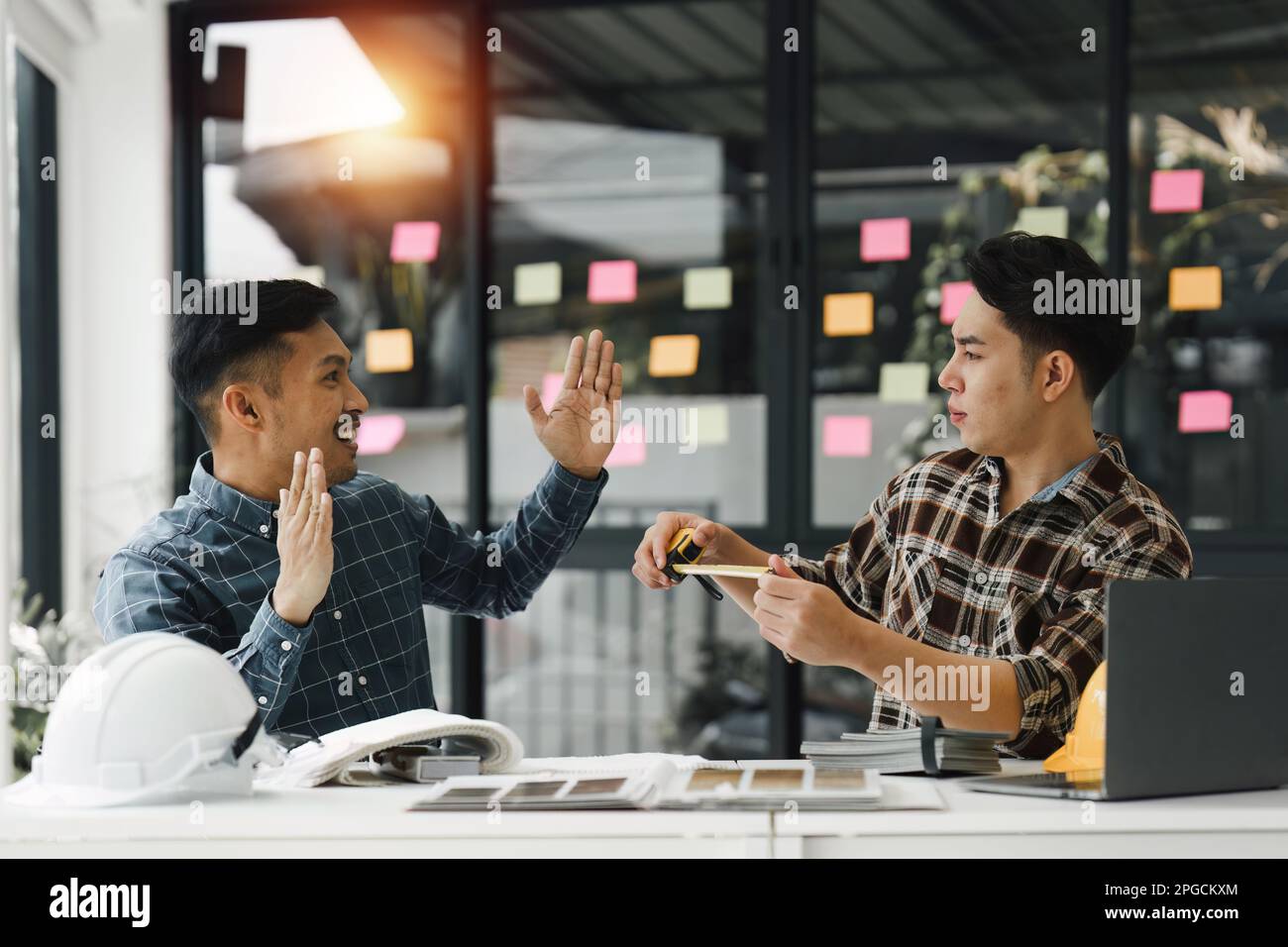 Architecture and engineering team working together at construction site ...