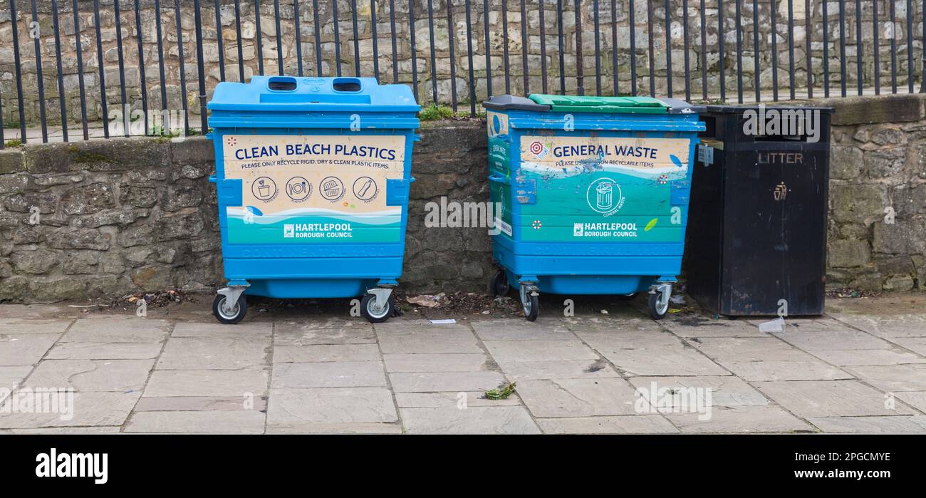 A wheely bin on the seafront at Hartlepool,England,UK specifically for plastic waste to stop beach pollution.Also general waste bin Stock Photo
