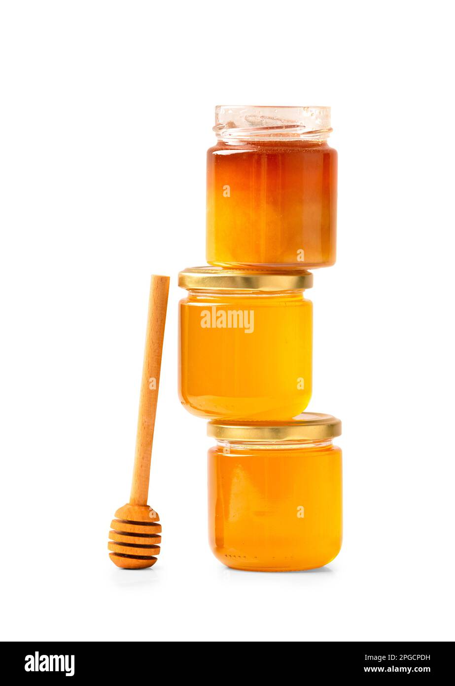 Honey in glass jars with dipper. Organic honey in jars on a white