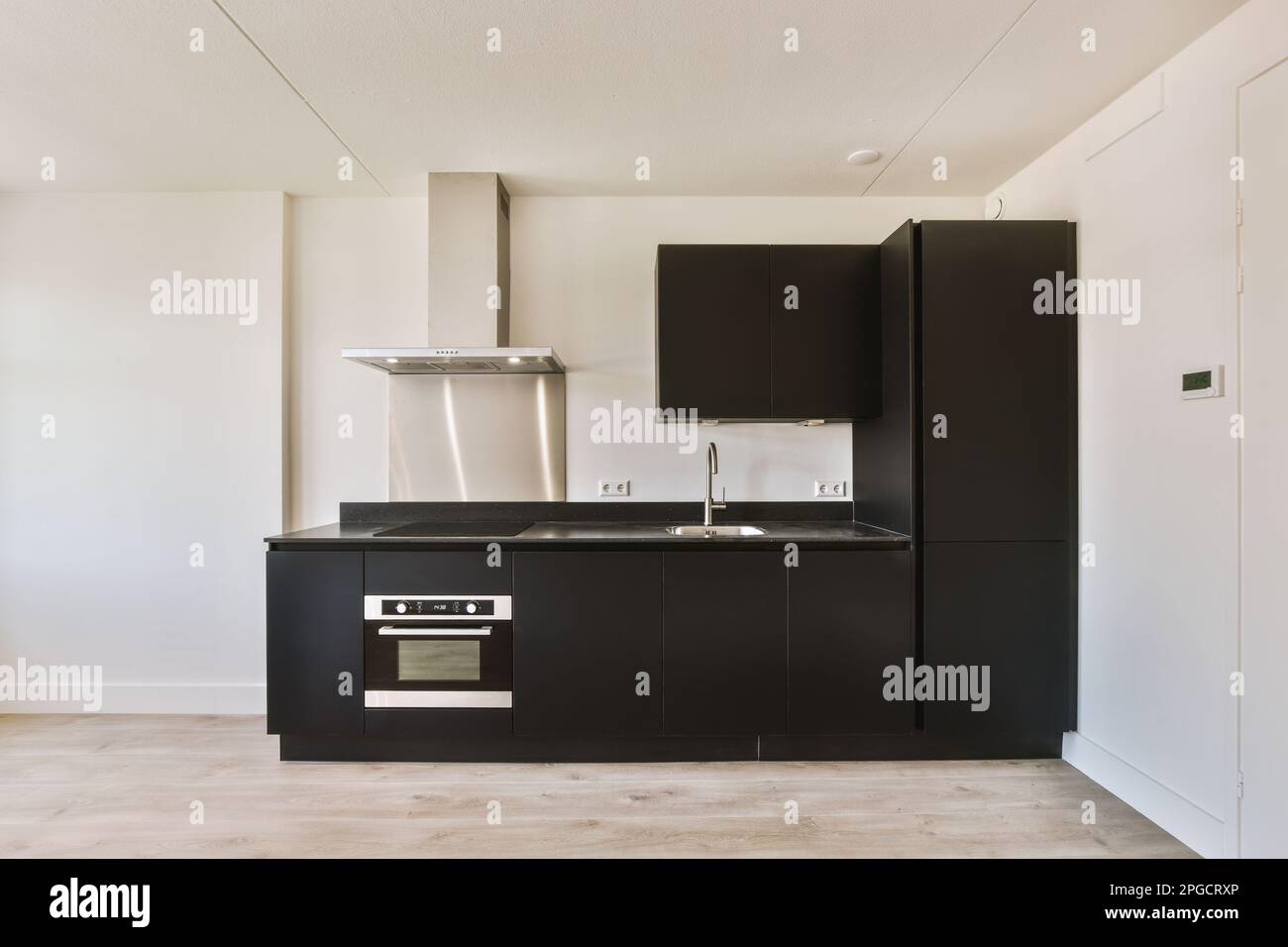 Interior design of contemporary kitchen with black and built