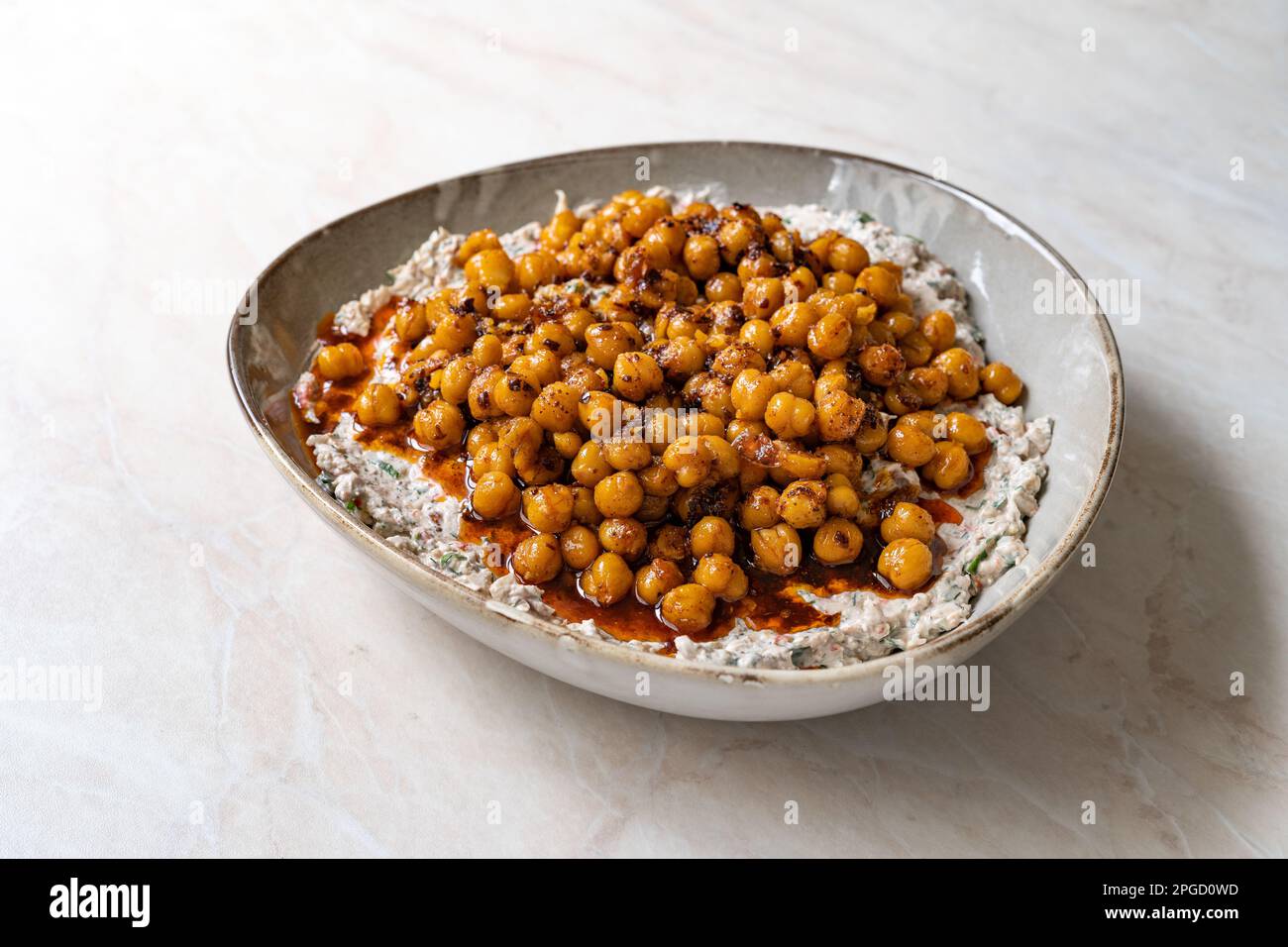 Spiced Chickpeas with Roasted Eggplant. traditional food Stock Photo