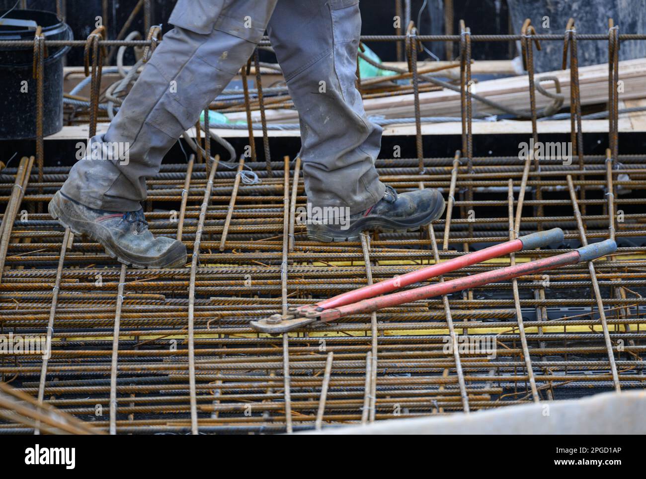 Dresden, Germany. 22nd Mar, 2023. A construction worker walks along a reinforced concrete ceiling at the building site of the extension to the headquarters of Carl Zeiss Digital Innovation GmbH at Fritz-Foerster-Platz. The technology company is further expanding its Dresden site. After completion, more than 400 jobs are to be created. Credit: Robert Michael/dpa/Alamy Live News Stock Photo