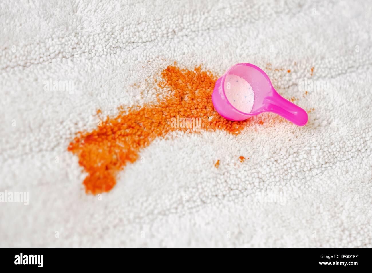 Uses of bleaching powder a white carpet indoors. Cleaning. closeup