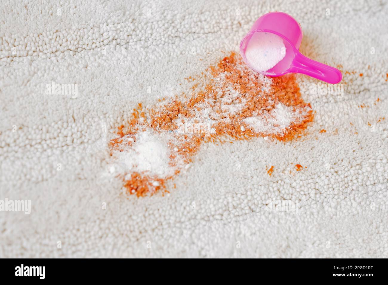 Uses of bleaching powder a white carpet indoors. Cleaning. closeup