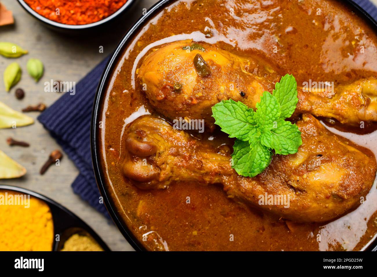 Spicy chicken curry with indian spices Stock Photo - Alamy