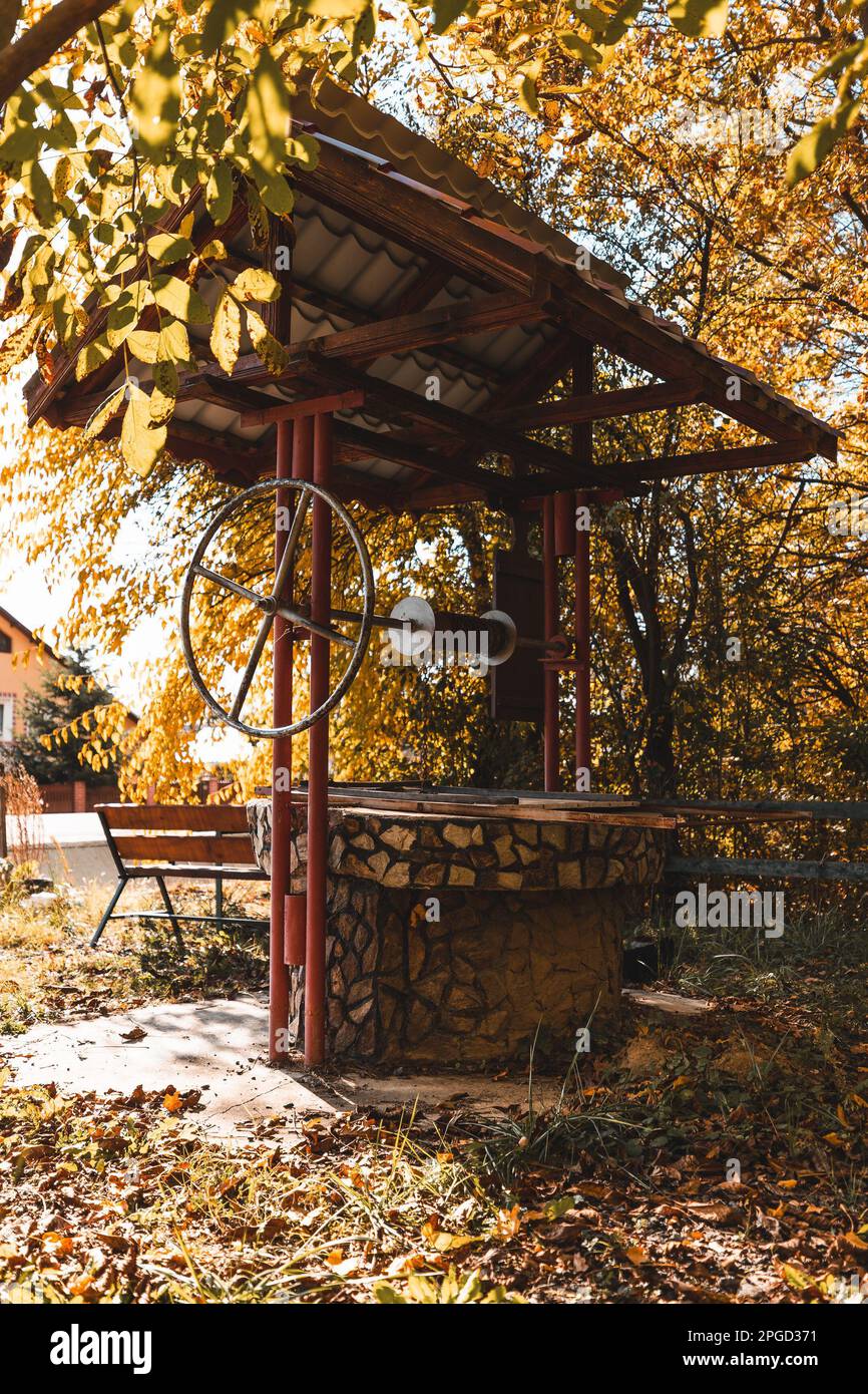 Stone water well and greenery hi-res stock photography and images - Alamy