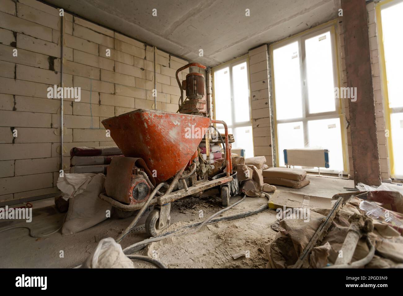 A specialized mixer for mixing dry plaster with water and automatically