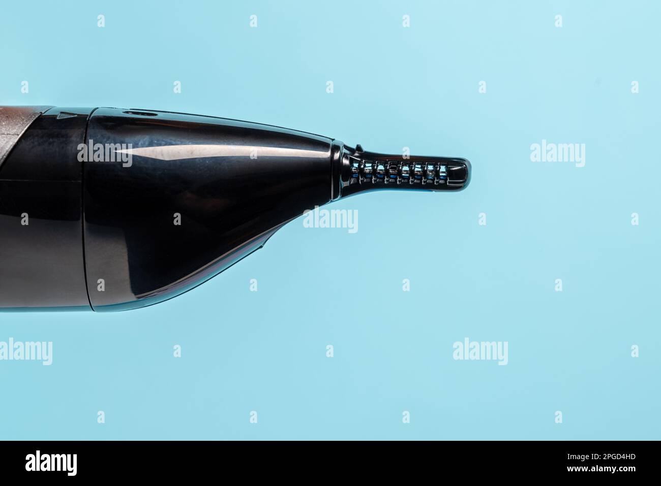 Top view of nose and ear hair trimmer isolated on blue background Stock Photo