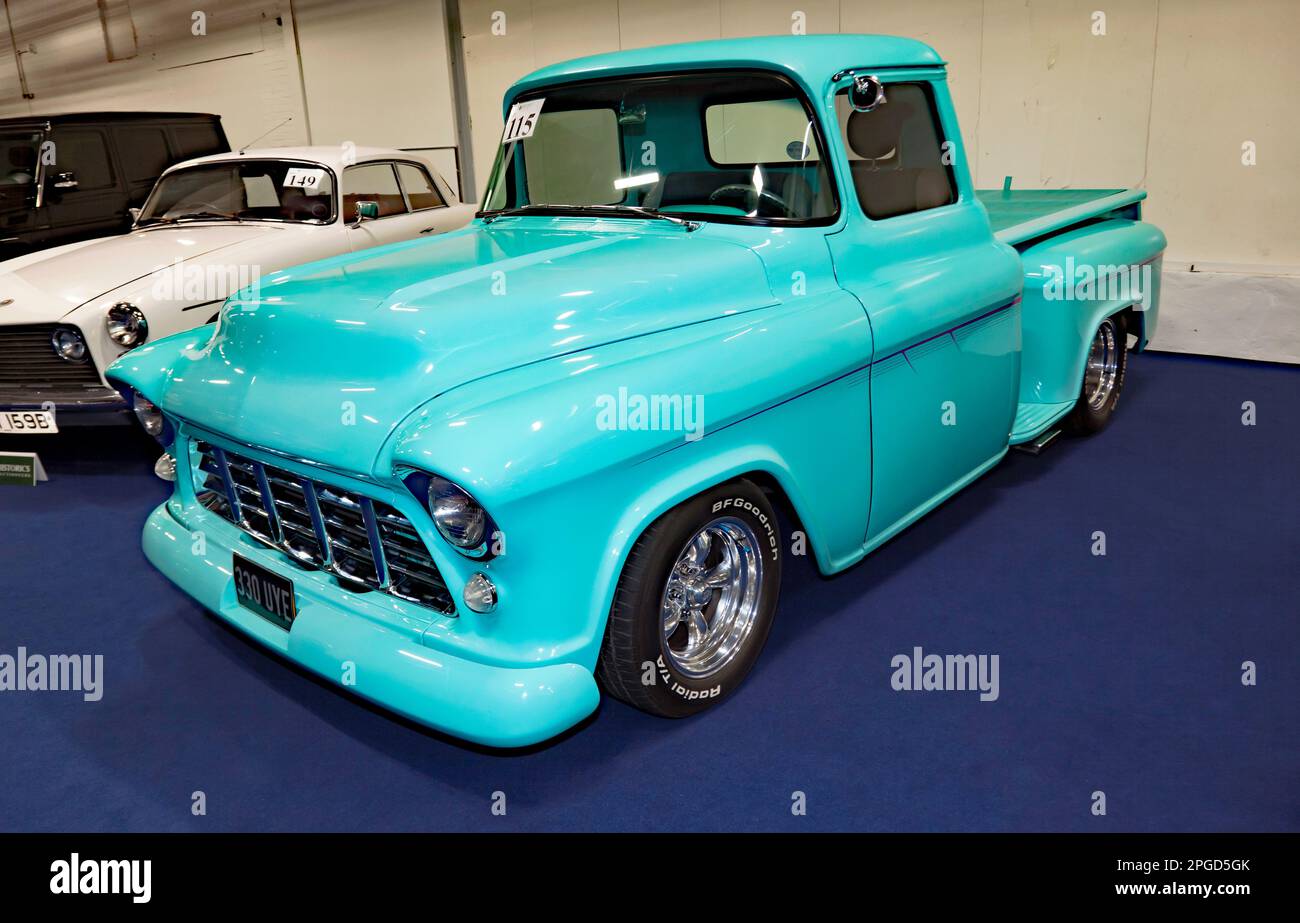 Threequarters Front View of a Blue, 1957, Chevrolet 3100 Sidestep Pick