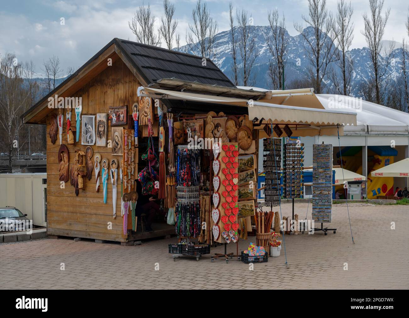 View of Souvenir shops on the streets selling winter clothes, colorful magnets, stuffed toys and collectibles captured at Zakopane, Poland. Stock Photo