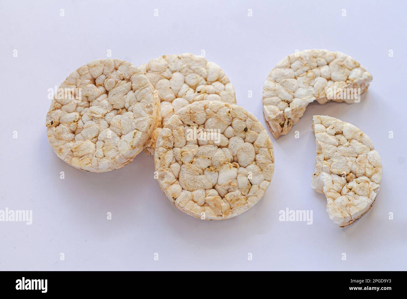 Group of puffed rice crackers on white background. Top view Stock Photo