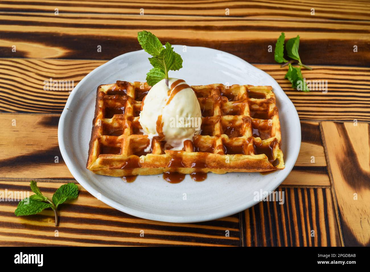 https://c8.alamy.com/comp/2PGDBAB/waffle-with-ice-cream-salted-caramel-on-white-plate-close-up-2PGDBAB.jpg