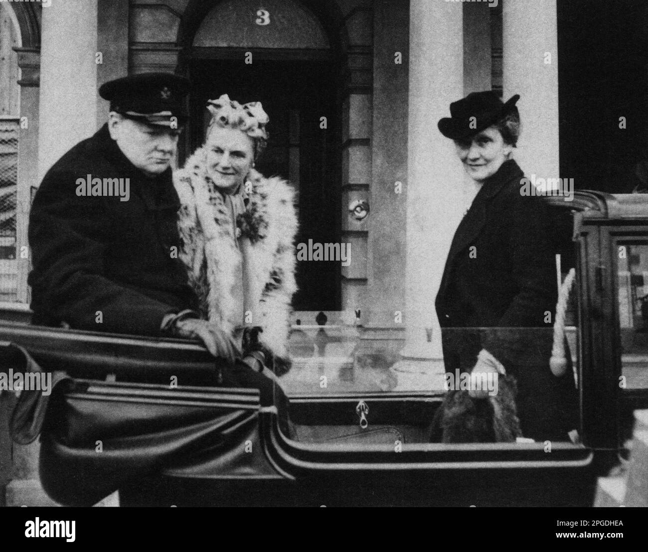 Winston Churchill in Plymouth to survey the bomb damage of the April raids with Clementine and Plymouth MP Nancy Astor.  May 1941 Stock Photo