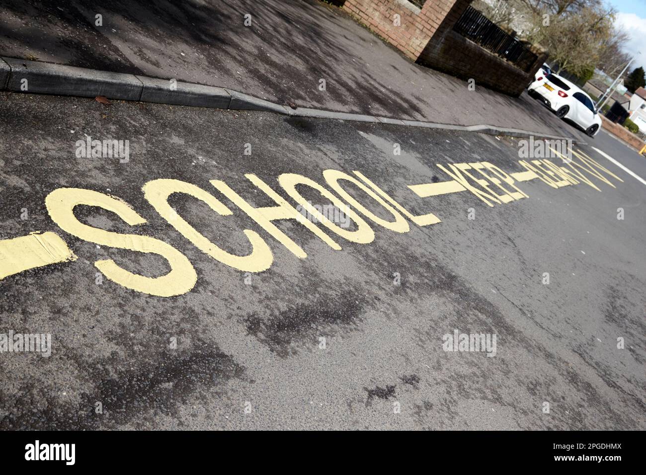 school keep clear road markings outside the entrance to a school