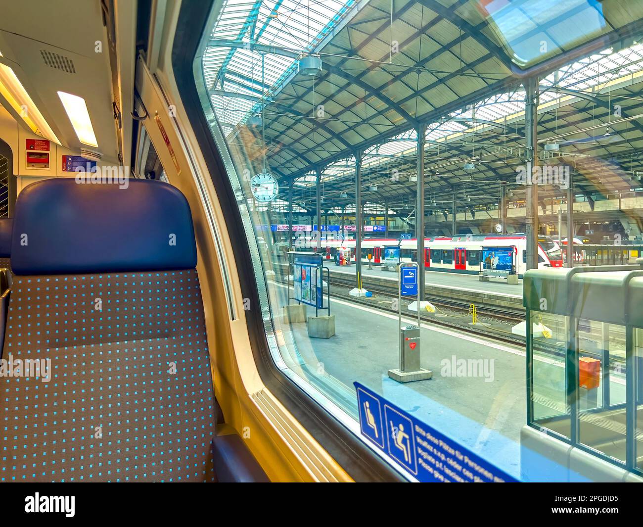 LUCERNE, SWITZERLAND - MARCH 31, 2022: In the train of Swiss Federal Railways on train station of Lucerne, on March 31 in Lucerne, Switzerland Stock Photo
