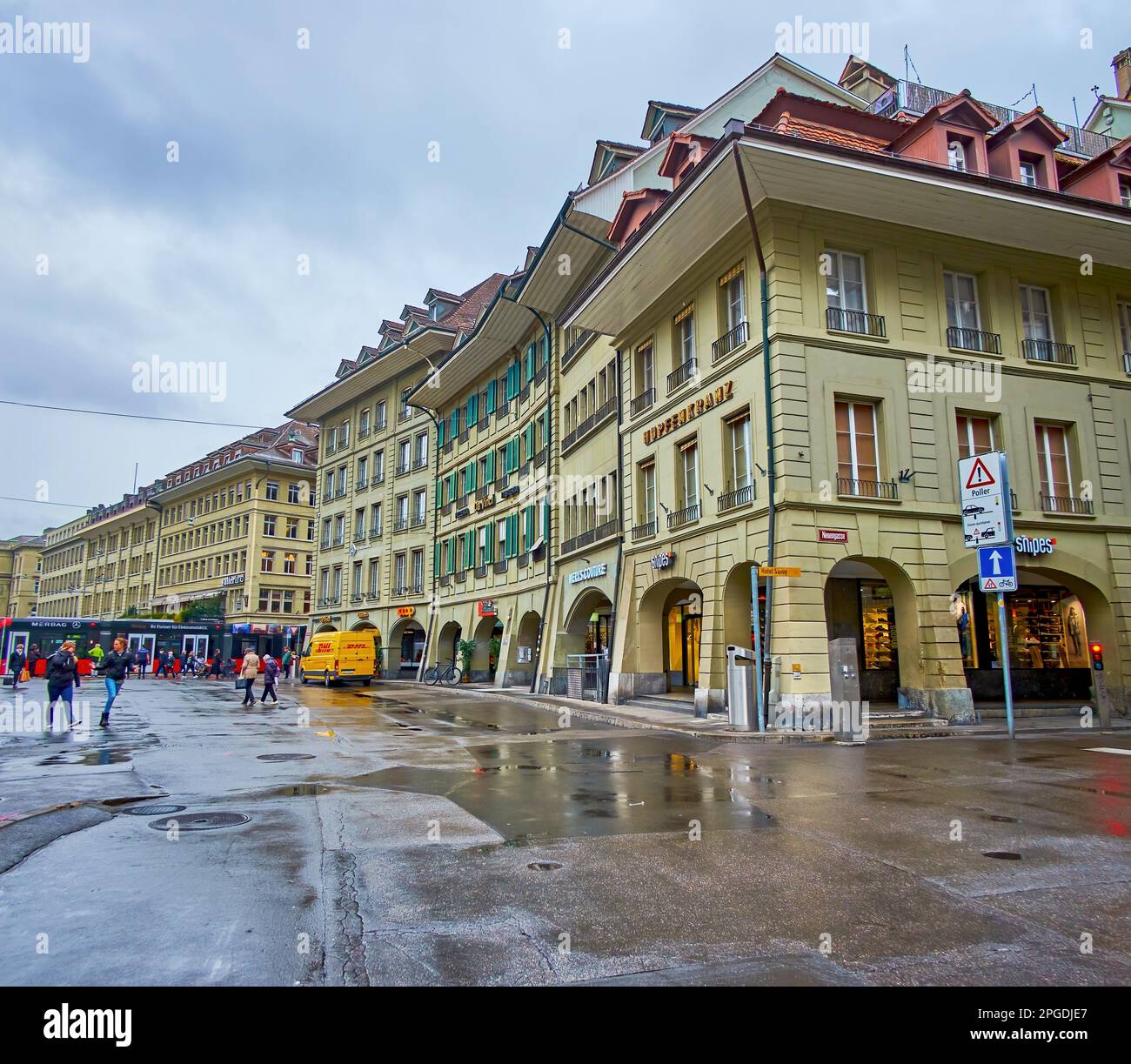 BERN, SWITZERLAND - MARCH 31, 2022: Waisenhausplatz square during spring rainy day, on March 31 in Bern, Switzerland Stock Photo