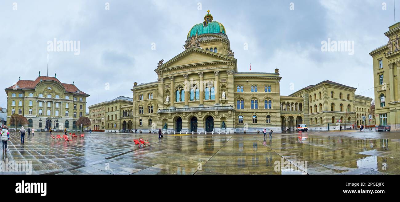 BERN, SWITZERLAND - MARCH 31, 2022: Panorama of Bundeshaus, the government and  parliament building on Bundesplatz square, on March 31 in Bern, Switze Stock Photo