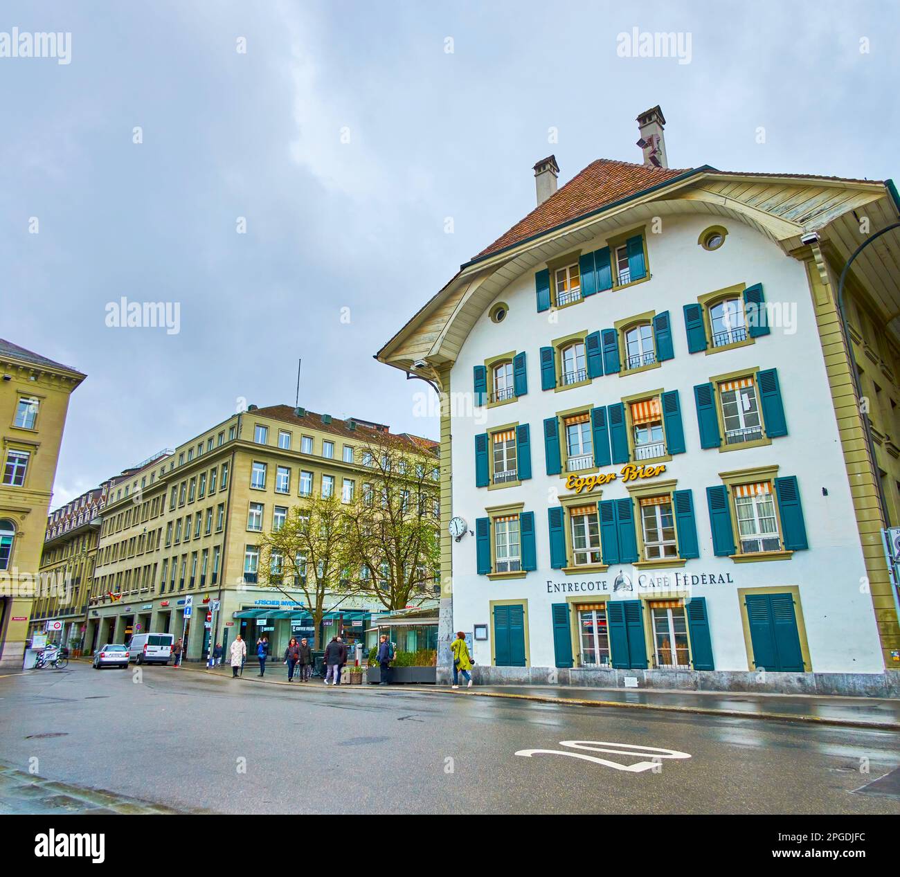 BERN, SWITZERLAND - MARCH 31, 2022: Scenic historic building on Bundesplatz with restaurant on ground floor, on March 31 in Bern, Switzerland Stock Photo