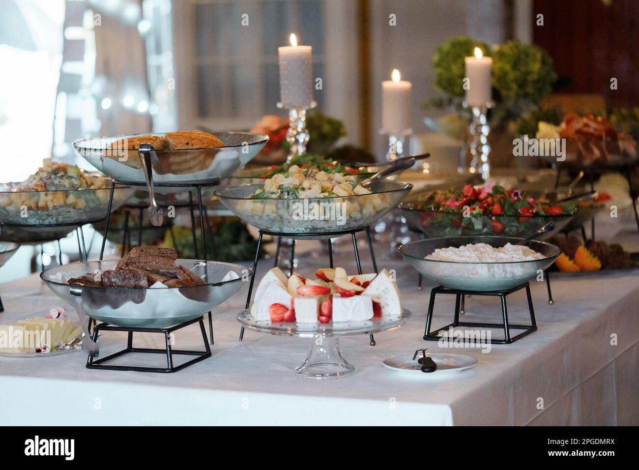 catering wedding buffet with different food snacks and beverages on