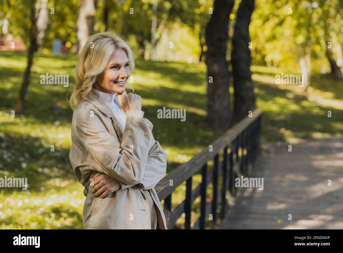 Mature blonde woman in coat hi-res stock photography and images - Alamy
