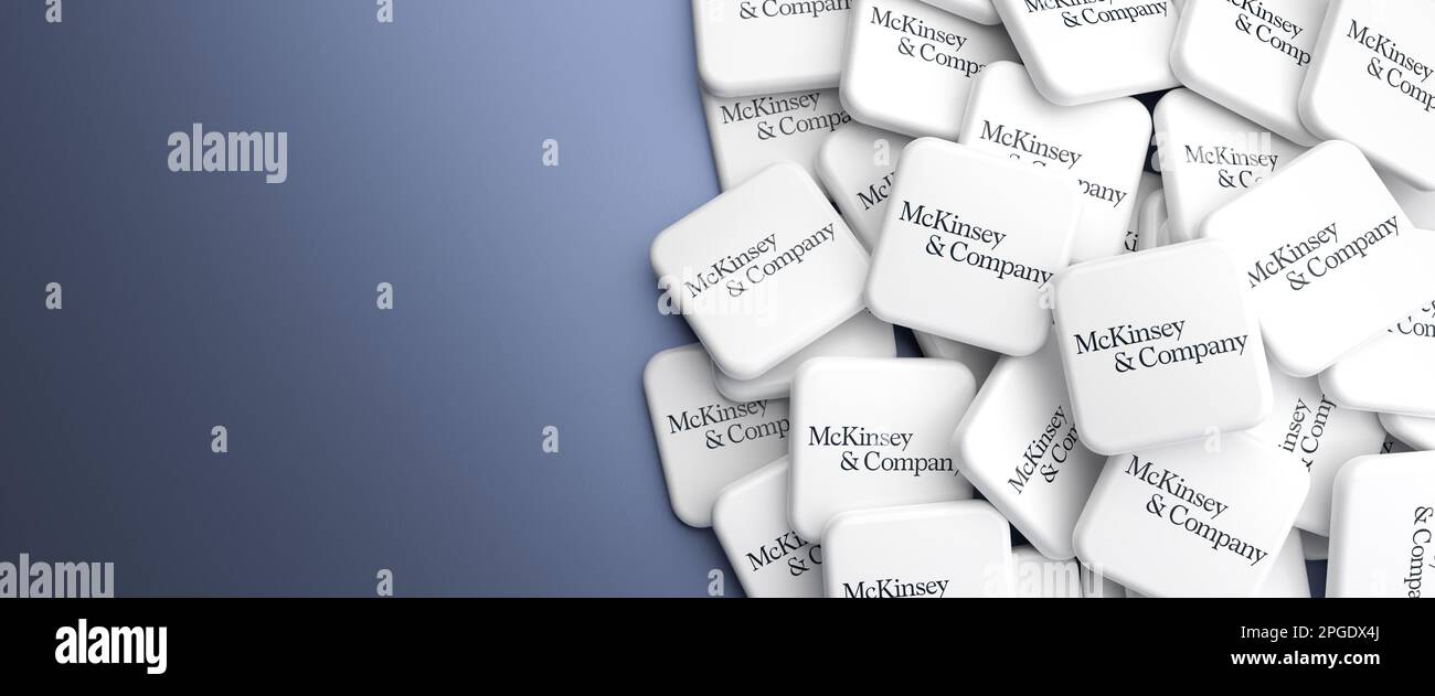 Logos of the Big Three management consulting company McKinsey & Company on a heap on a table. Web banner format with copy space Stock Photo