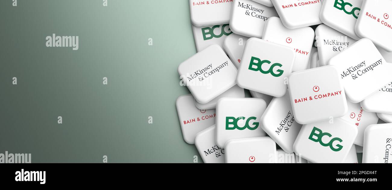 Logos of the Big Three management consulting companies Bain & Company, McKinsey & Company and Boston Consulting Group on a heap on a table. Web banner Stock Photo