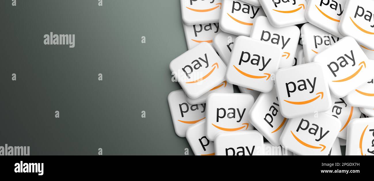 Logos of the payment solution Amazon Pay on heap on a table. Web banner format, copy space Stock Photo