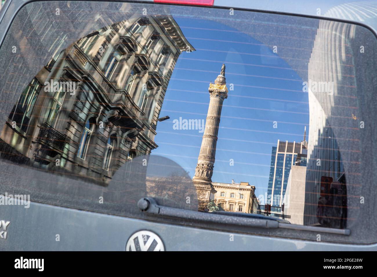 Congress Column in Brussels reflected in the windscreen of a parked car. Stock Photo