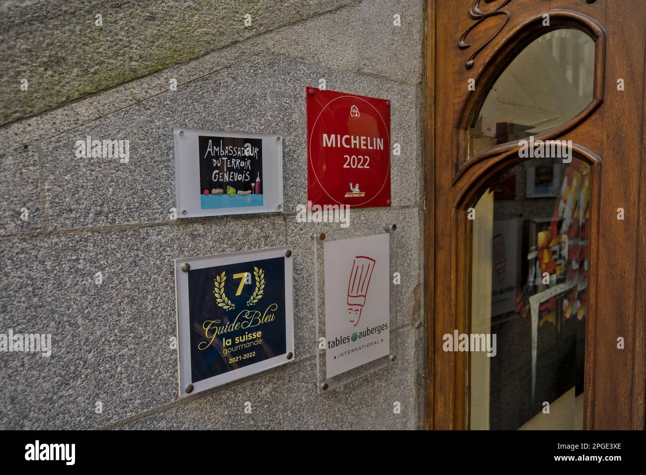 Restaurant displaying it´s numerous recognitions in a wall outside the establishment Stock Photo