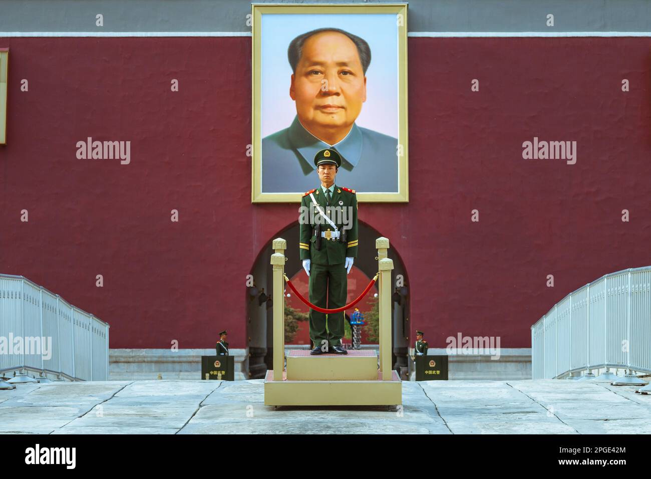 Beijing, China: Tiananmen square, entrance to Forbidden City. A Chinese soldier stands at attention with a portrait of Mao Zedong behind Stock Photo