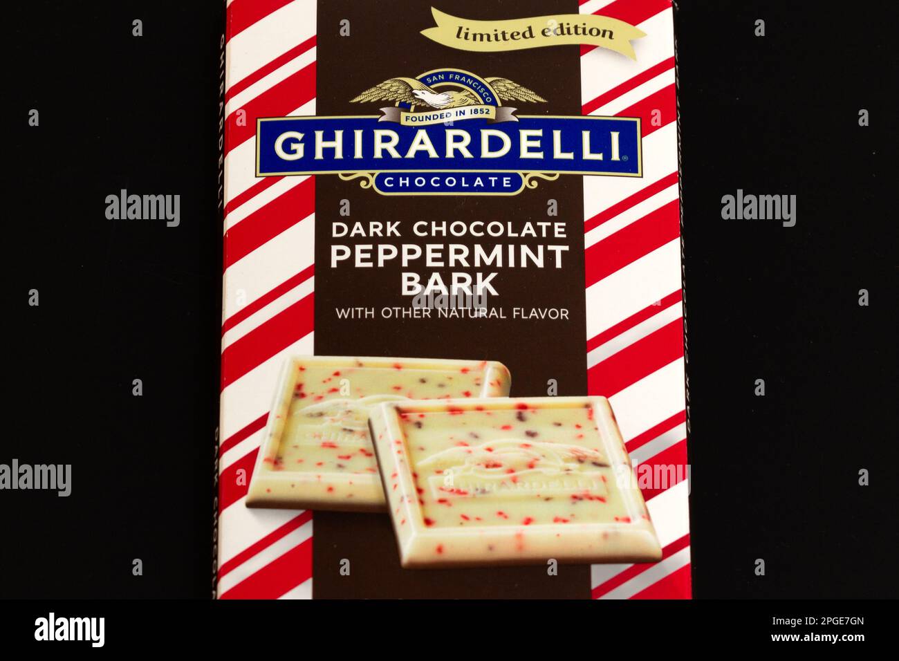 STILLWATER, MN, USA - DECEMBER 25, 2022: Ghiradelli Dark Chocolate Peppermint Bark candy bars and trademark logo. Stock Photo