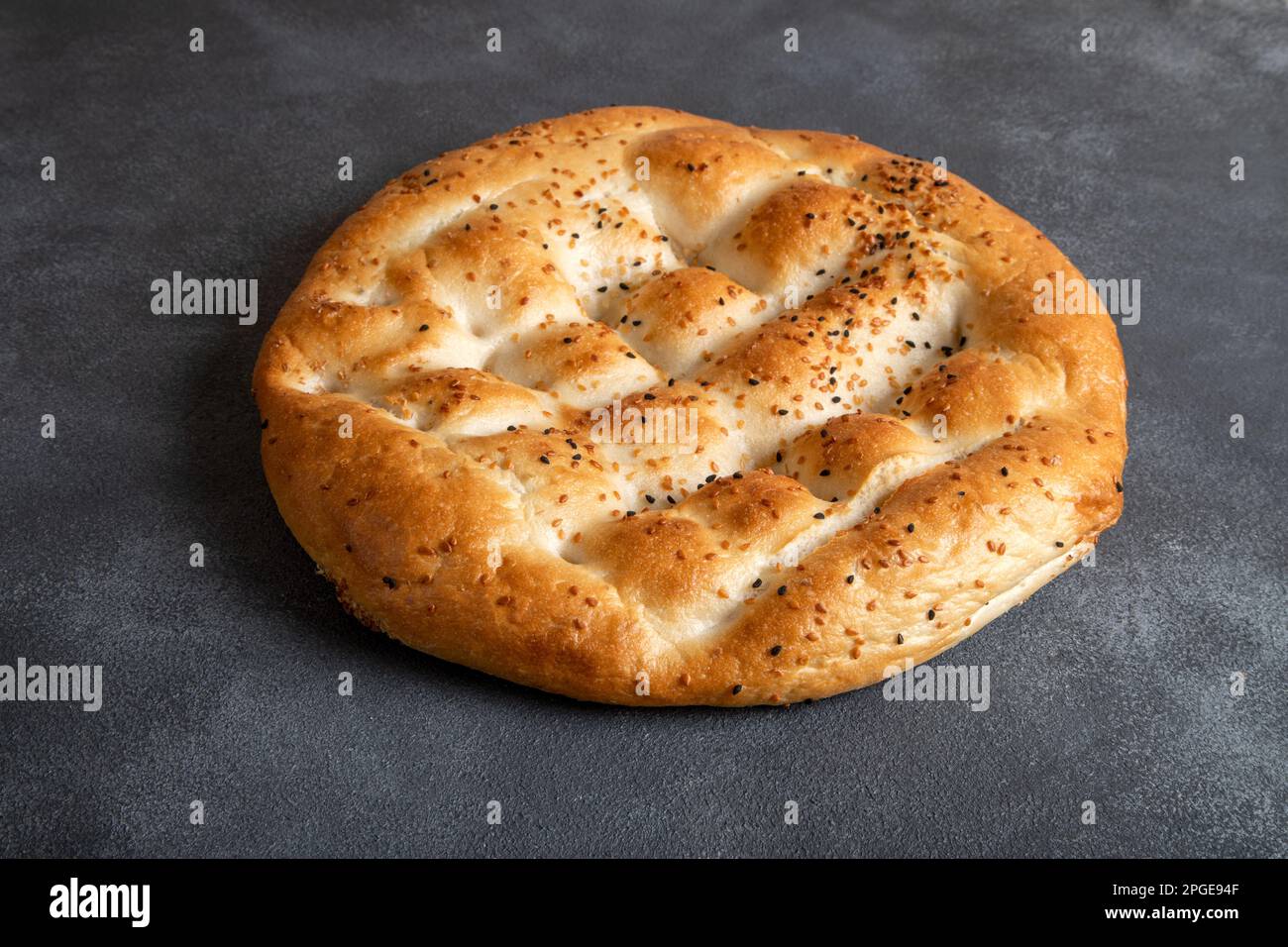 Traditional Ramadan pita on black background.Holy bread for Muslims Stock Photo