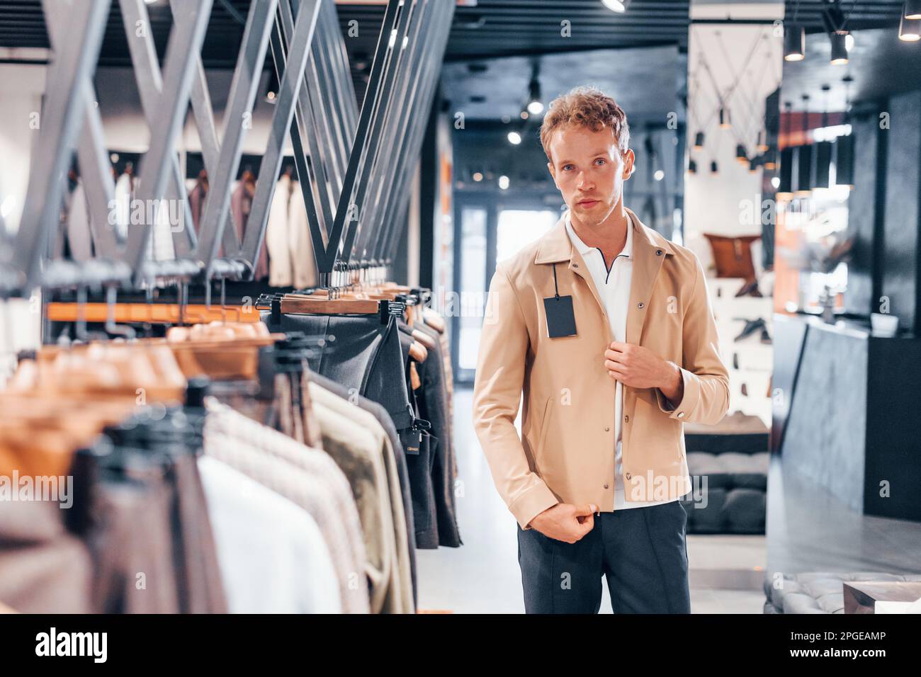 Young adult male clothes shopping Stock Photo - Alamy