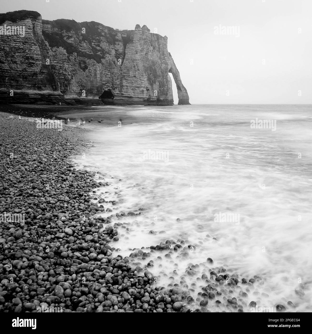 Beach near the French city of Etretat with cliffs Falaise d'Aval Stock Photo