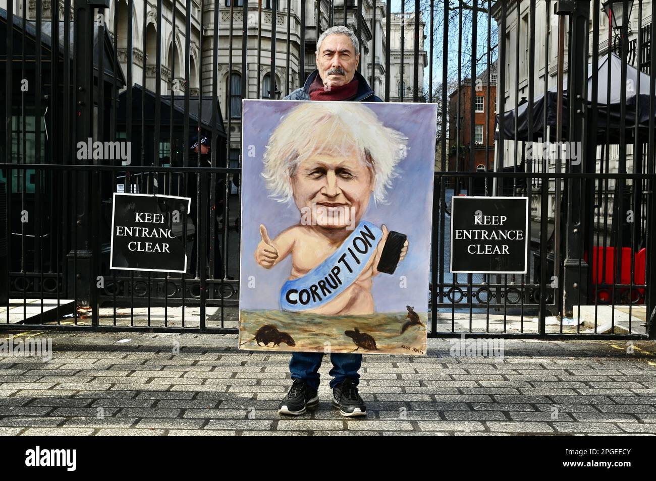 London, UK. Political artist Kaya Mar showed a selection of his Boris Johnson portraits outside Downing Street. The ex prime minister is fighting against accusations that he misled Parliament over lockdown parties at 10 Downing Street. Credit: michael melia/Alamy Live News Stock Photo